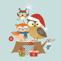 Obraz premium Christmas greeting card with cute owl family