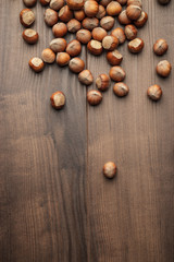 hazelnuts on the brown wooden table