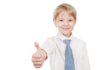 Smiling young  boy hand gesturing thumb up 