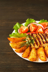 fresh salad with tomatoes and lettuce with meat and potatoes