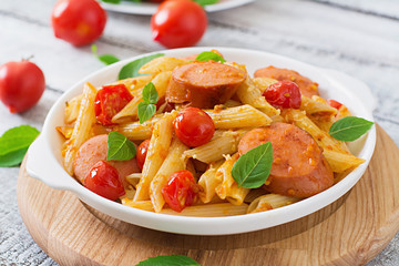 Penne pasta with tomatoes and sausage