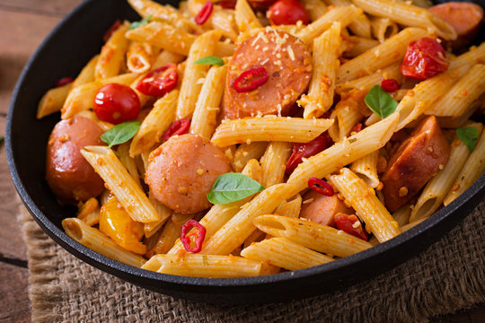 Penne pasta with tomatoes and sausage