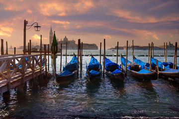 Dramatic sunset over gondola pier
