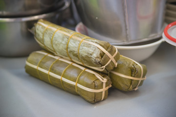 Packaging of banana leaves for Vietnamese steamed pork sausage s