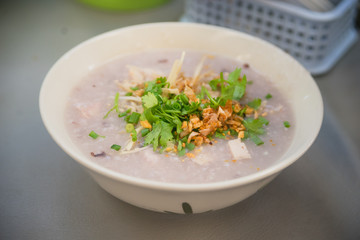 Soft boiled rice with pork and vegetable in breakfast time