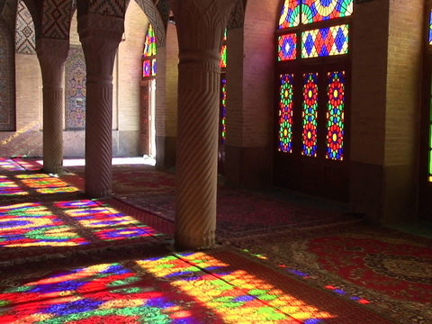 Sun shines through stained glass windows inside the Nasir Molk Mosque in Shriaz, Iran. 