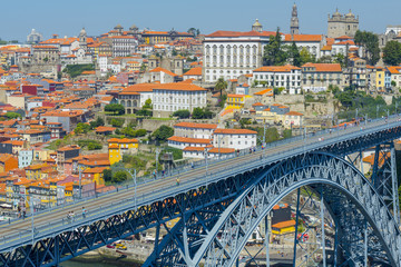 Obraz premium Porto historic city centre with Ponte Luis I Bridge over Douro river from lookout of Mosteiro da Serra do Pilar in Portugal