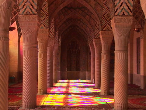 Sun shines through stained glass windows inside the Nasir Molk Mosque in Shriaz, Iran. 