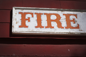 aged and worn vintage fire station sign