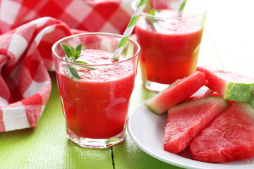 Fresh watermelon juice in the glass on wooden table