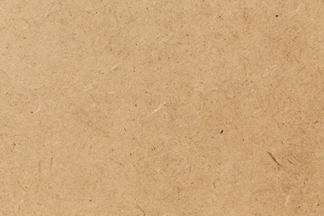 Pressed beige chipboard texture.