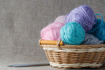 Fototapeta na wymiar Clews of colored yarn with needle