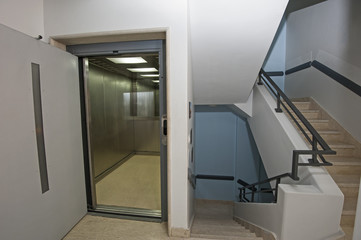 Fototapeta na wymiar Building interior with lift and staircase