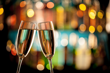 Glasses of champagne on bar counter