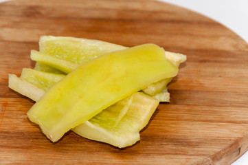 Cleaned and sliced green paprika on the kitchen wooden board