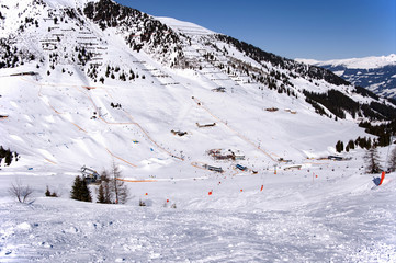 Mayrhofen Ski resort midle station area with ski lifts, pistes and skiers. Zillertal Alps, Tirol,...