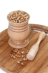 Soy beans in the wooden mortar