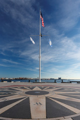 The American Flag at Long Wharf Pier. Long Wharf is a historic pier in Boston, Massachusetts which once extended from State Street into Boston Harbor.