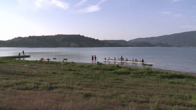 Time lapse of eight person rowing sweep entering the water on Lake Casitas in Oak View, California.