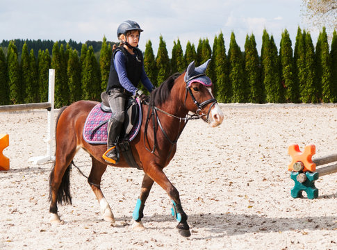Girl riding on sport pony