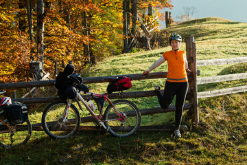 Obraz premium Biker stretch legs at the begining of the ride