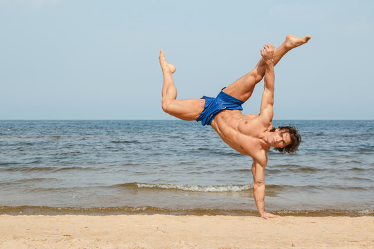 Man doing workout on the beach