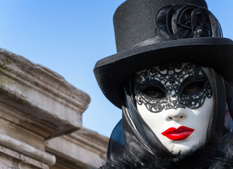 Fototapeta na wymiar Mysterious black woman with red lips at Venice Carnival