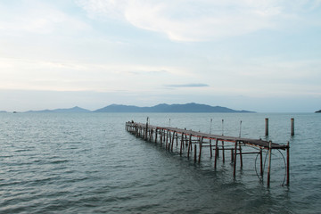 The old bridge ruined on the sea
