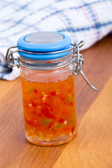 Hot pepper jelly preserving on table