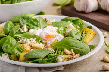 Spinach salad with egg benedict