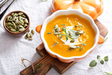 Pumpkin soup with cream, herbs and seeds