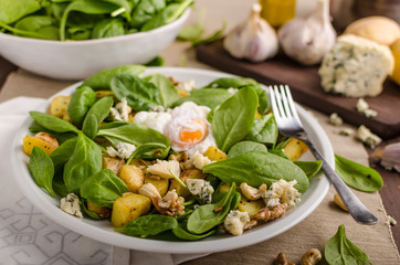 Spinach salad with egg benedict