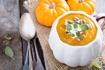 Pumpkin soup with cream, herbs and seeds