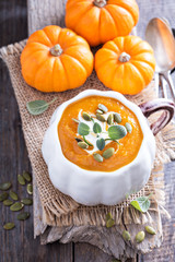 Pumpkin soup with cream, herbs and seeds