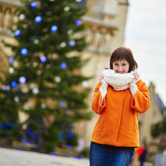 Happy young tourist in Paris on a winter day