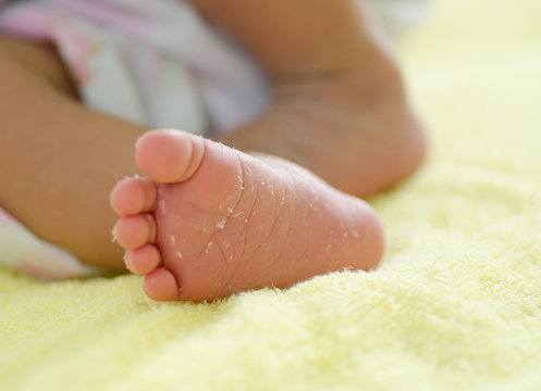 Close up baby feet after 4 days newborn