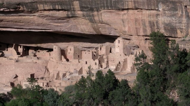 Zoom out from ancient American Indian dwellings at Mesa Verde, Colorado.