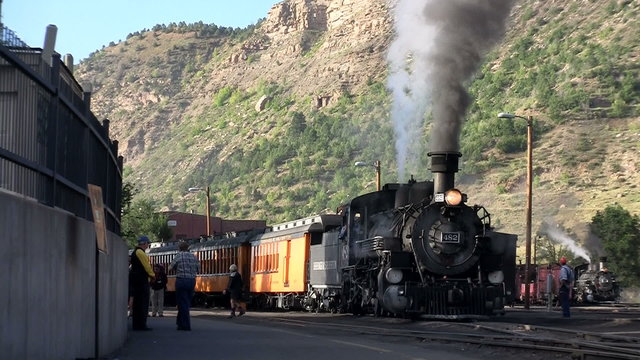 A steam train at the station.