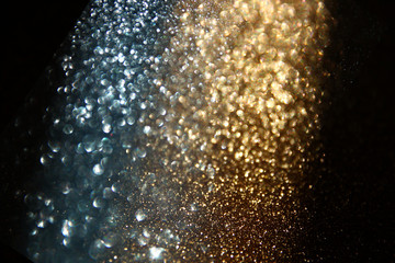 Obraz premium glitter vintage lights background. gold and black. defocused 
