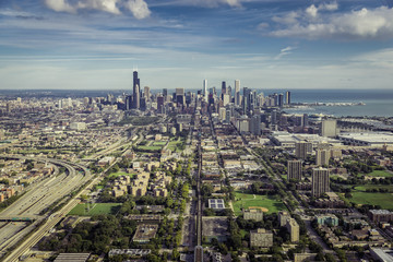 Naklejka na ściany i meble Aerial view through Chicago Downtown with suburbs