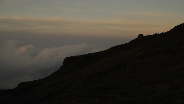 Slow pan from above the clouds