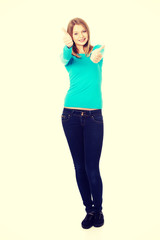 Fototapeta premium Woman showing thumbs up with both hands