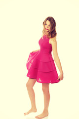 Young blonde woman with pink skirt 