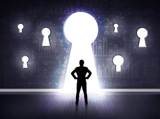 Obraz premium businessman looking through keyhole