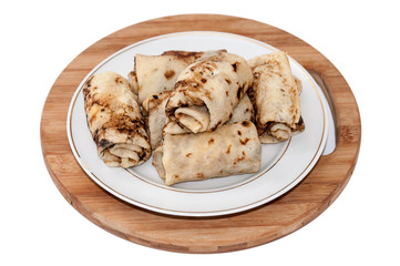 Stuffed rolled pancakes with sour cream fried bacon