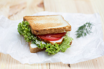Healthy ham sandwich with cheese, tomatoes and lettuce
