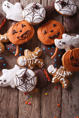 Funny delicious ginger biscuits for Halloween close-up. vertical top view
