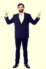 Businessman showing the size with two fingers.