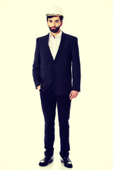 Handsome engineer in protective helmet.