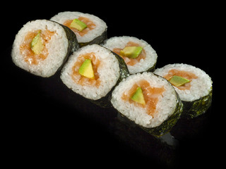 hosomaki sushi with smoked salmon, avocado and rice